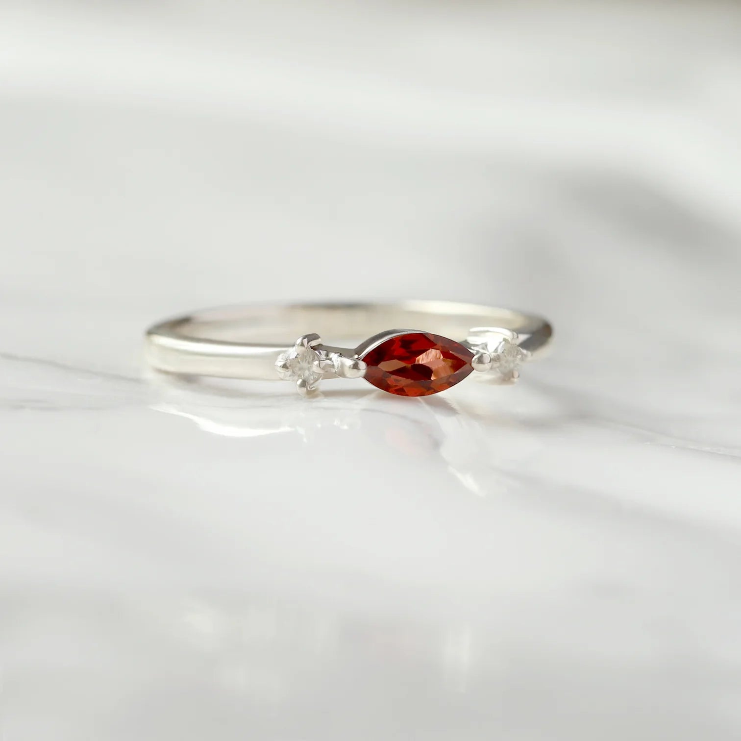 Giotto Garnet Ring with side Moissanites Ring