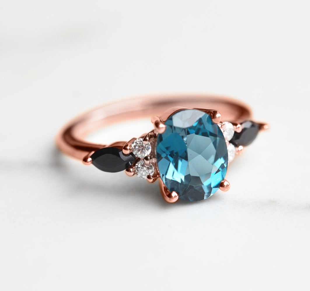 Lauryn Oval London Blue Topaz Ring with Moissanites and Black Spinel