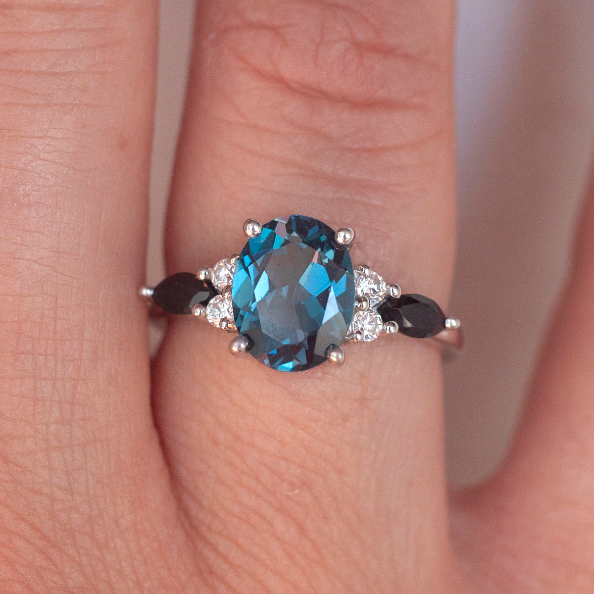 Lauryn Oval London Blue Topaz Ring with Moissanites and Black Spinel