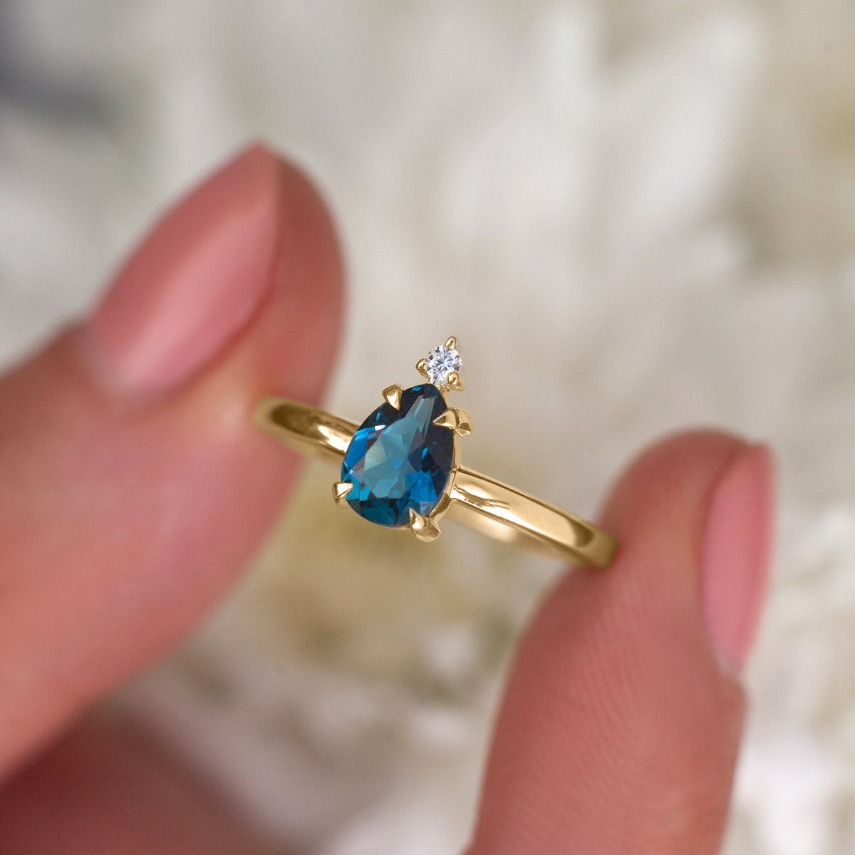 Eva Queen Pear London Blue Topaz Ring with Moissanite